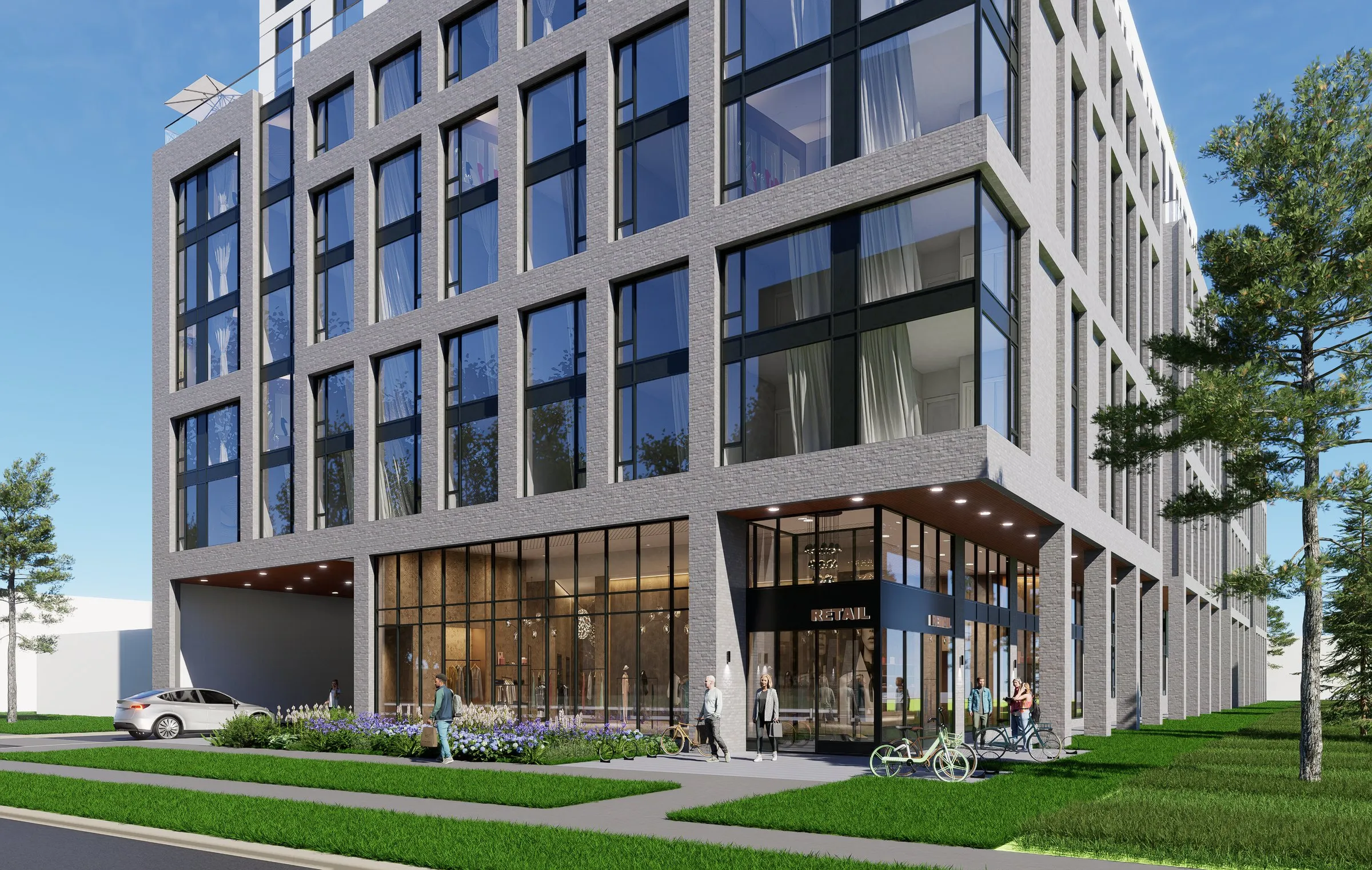 Rendering of a grey-brick building with a glazed ground floor and bicycles.